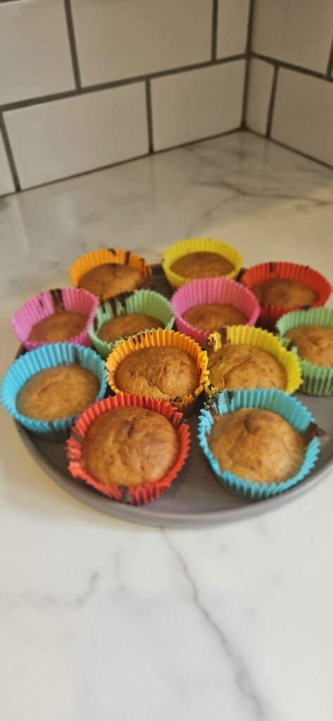 picture of freshly bakes cakes in rainbow cases on a plate